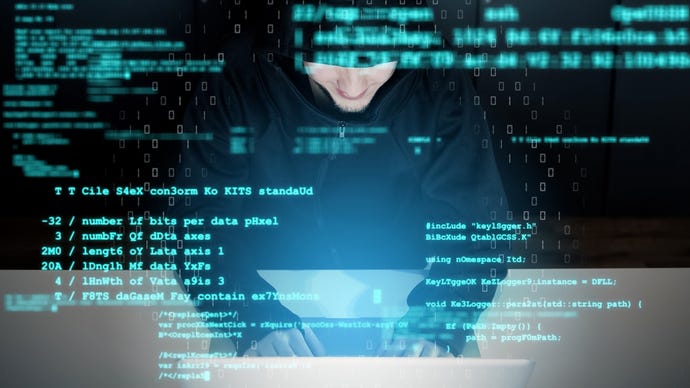 Image depicting a hacker on a keyboard using malware 